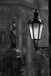 Low angle view of street light against building