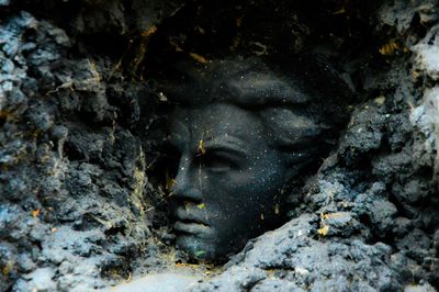 Close-up of lion statue in cave