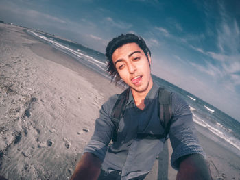 Portrait of man standing on beach