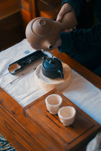 Midsection of man working on table