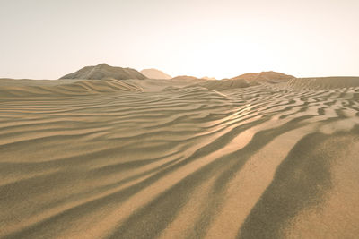 Scenic view of desert against clear sky