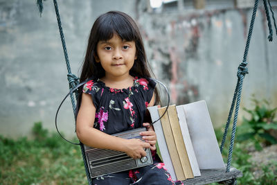 Portrait of happy girl standing outdoors