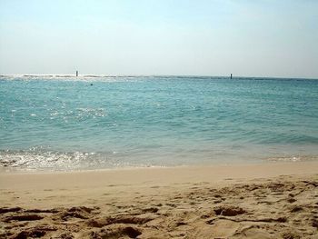 Scenic view of sea against blue sky