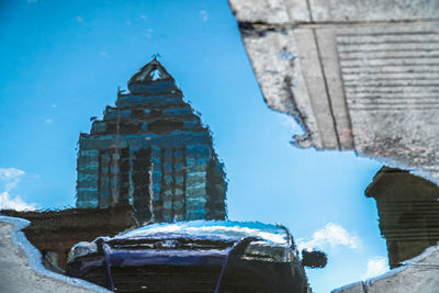 Low angle view of building against sky during winter