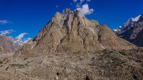 Rock formations on mountain against sky