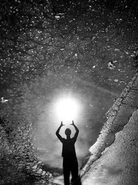 Woman standing in pond