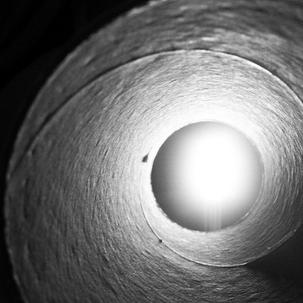 indoors, close-up, wood - material, circle, full frame, wooden, no people, selective focus, textured, backgrounds, pattern, wood, electricity, single object, focus on foreground, geometric shape, illuminated, high angle view, sunlight, lighting equipment