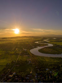 Scenic view of landscape against sky during sunset