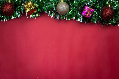 Close-up of christmas decoration against wall