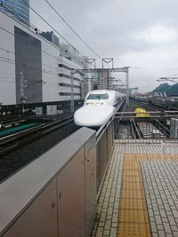 Train on railroad track against sky