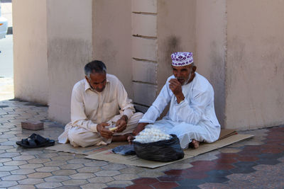 Full length of a woman sitting outdoors