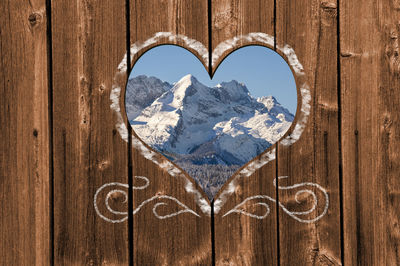 Close-up of heart shape on wooden door