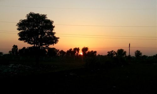 Scenic view of landscape at sunset