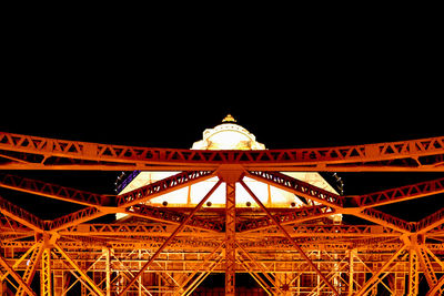 Low angle view of ferris wheel at night