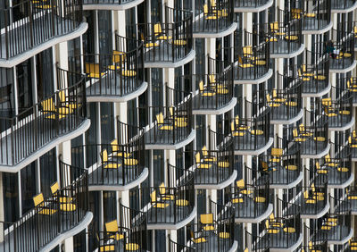 Chairs and tables in city at night