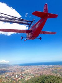 Low angle view of airplane flying in sky