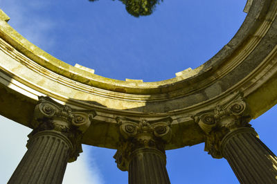 Low angle view of historical building against blue sky