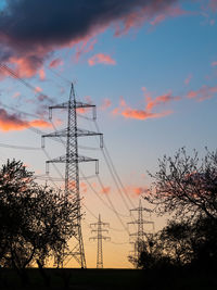 Low angle view of silhouette trees against sky during sunset