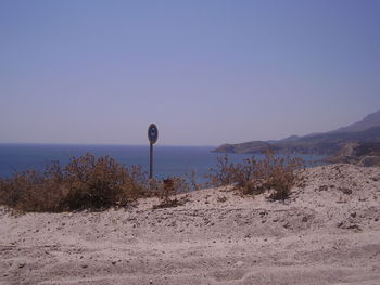 Scenic view of beach against clear sky