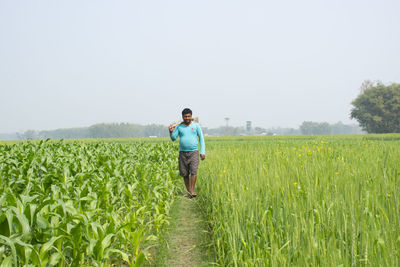 Full length of man standing on field