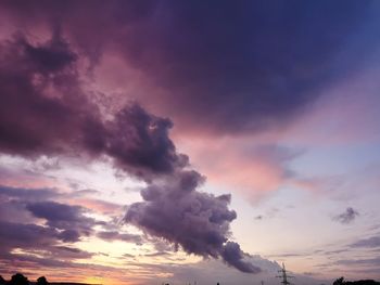 Low angle view of dramatic sky during sunset