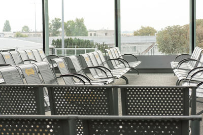 Rows of empty chairs at the airport lounge.