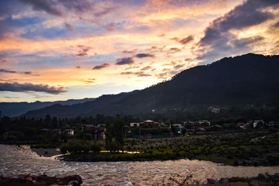 Scenic view of landscape against sky during sunset