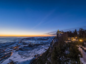 Scenic view of frozen sea against sky at sunset