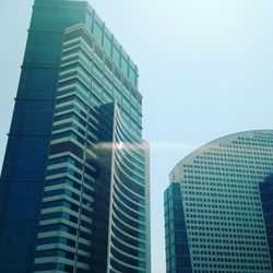 Low angle view of modern buildings against clear sky