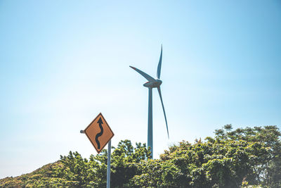 Low angle view of windmill against clear sky