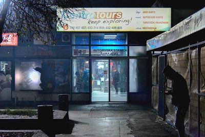 Illuminated sign on glass window