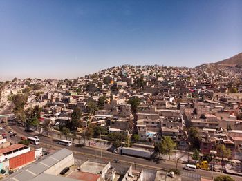 High angle shot of townscape against clear blue sky