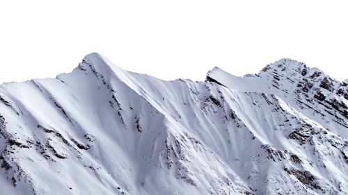 Scenic view of snowcapped mountains against clear sky