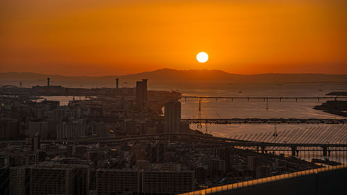 Scenic view of buildings against sky during sunset