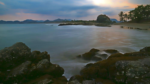 Scenic view of sea against sky at sunset