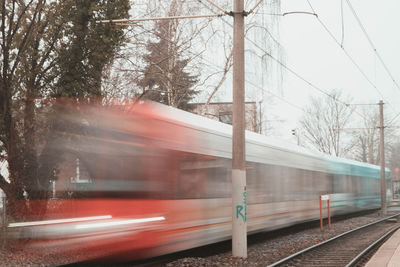 Blurred motion of train at railroad track