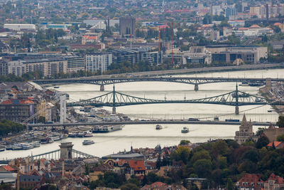 High angle view of bridge over river and buildings in city