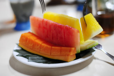 Close-up of fruits in plate on table