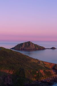 Scenic view of sea against clear sky during sunset