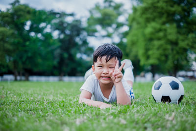 Boy with ball on grass