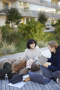 Friends sitting outside together