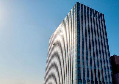 Low angle view of modern building against clear sky