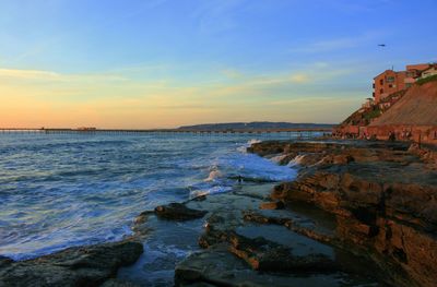 Scenic view of sea against sky at sunset