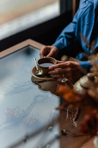 Woman's hands holding coffee