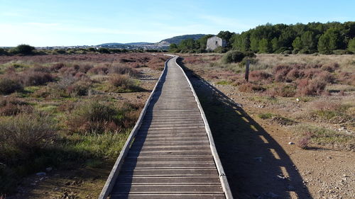 View of empty country road along landscape