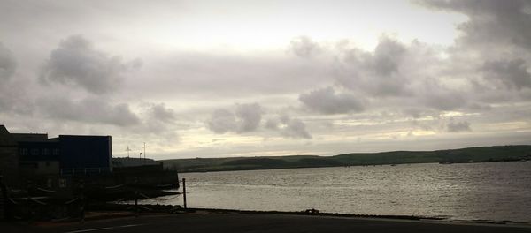 Scenic view of sea against cloudy sky