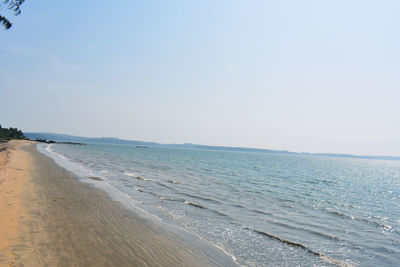 Scenic view of beach against clear sky