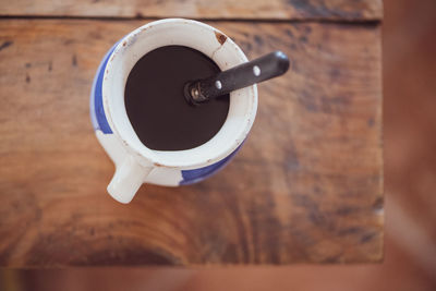 High angle view of coffee cup on table