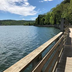 Pier over lake against sky