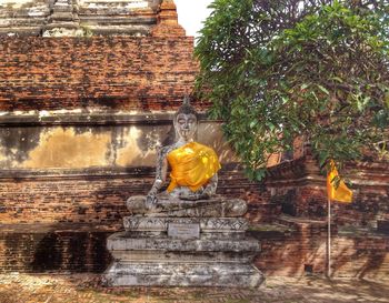 Built structure against brick wall